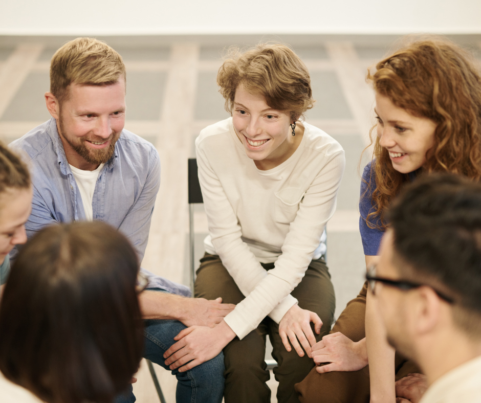 A group of people discussing employee referral program