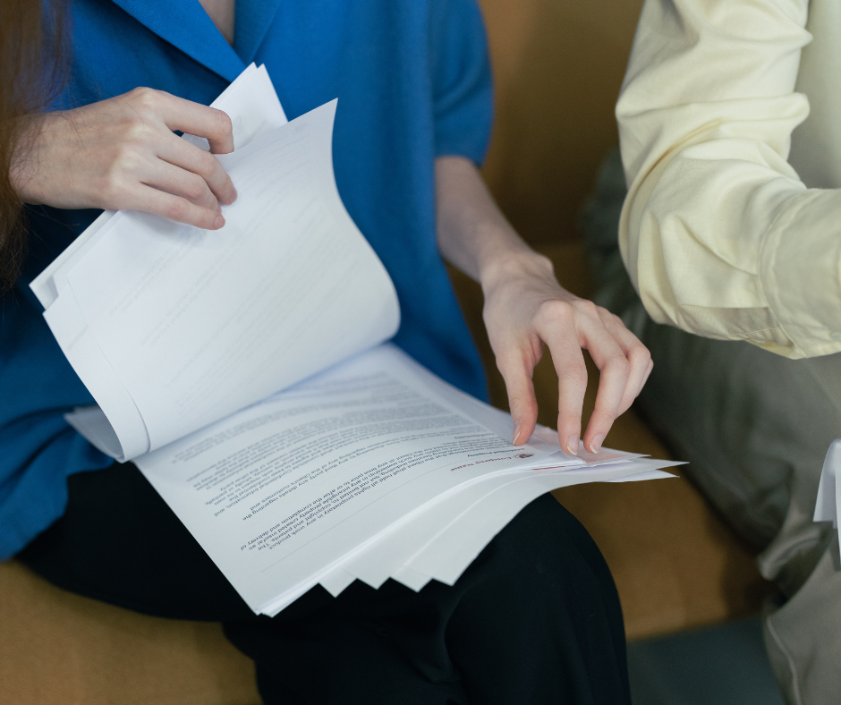 A person reviewing and updating a policy document