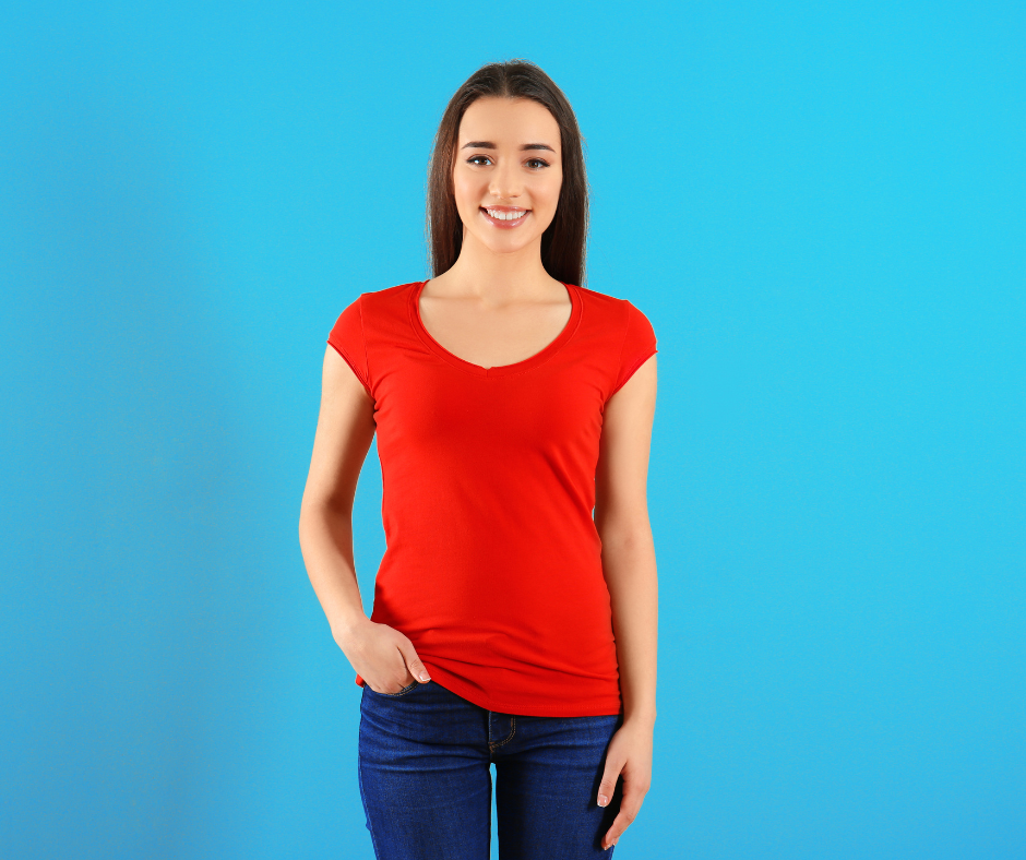 A target employee wearing a red shirt and blue jeans, following the dress code