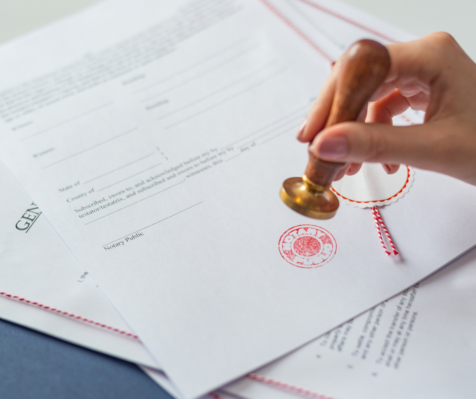 An image of a signed document being stamped by a notary, representing the importance of a notarized contract in online notarization services.