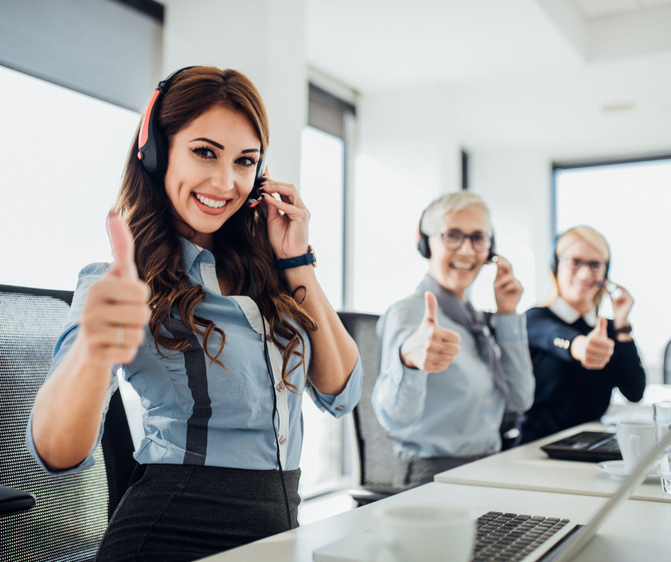 An image showing a team of customer service representatives with smiles on their faces, representing the culture of care in creating a positive customer experience.