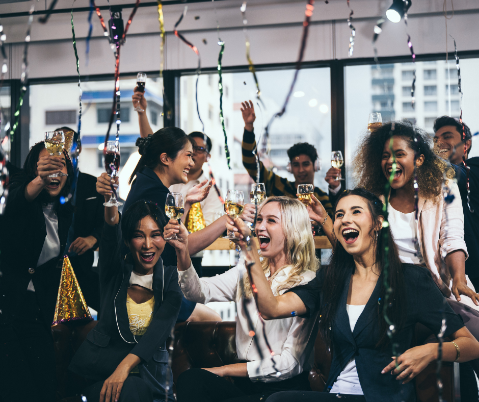 Group of people celebrating success and recognition in a positive workplace