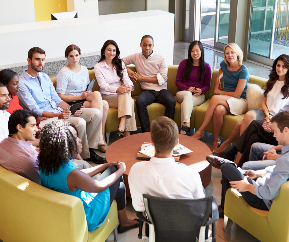 Group of people discussing company culture in a modern office