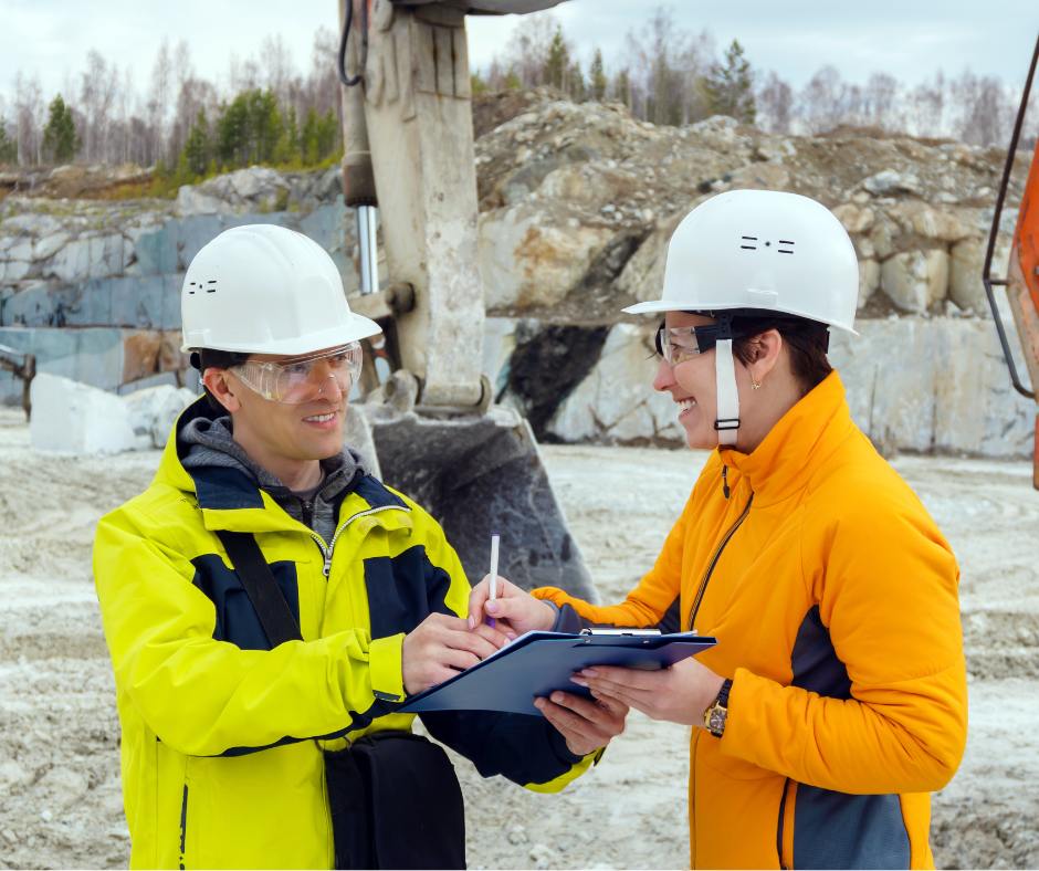 Two people discussing a construction contract document