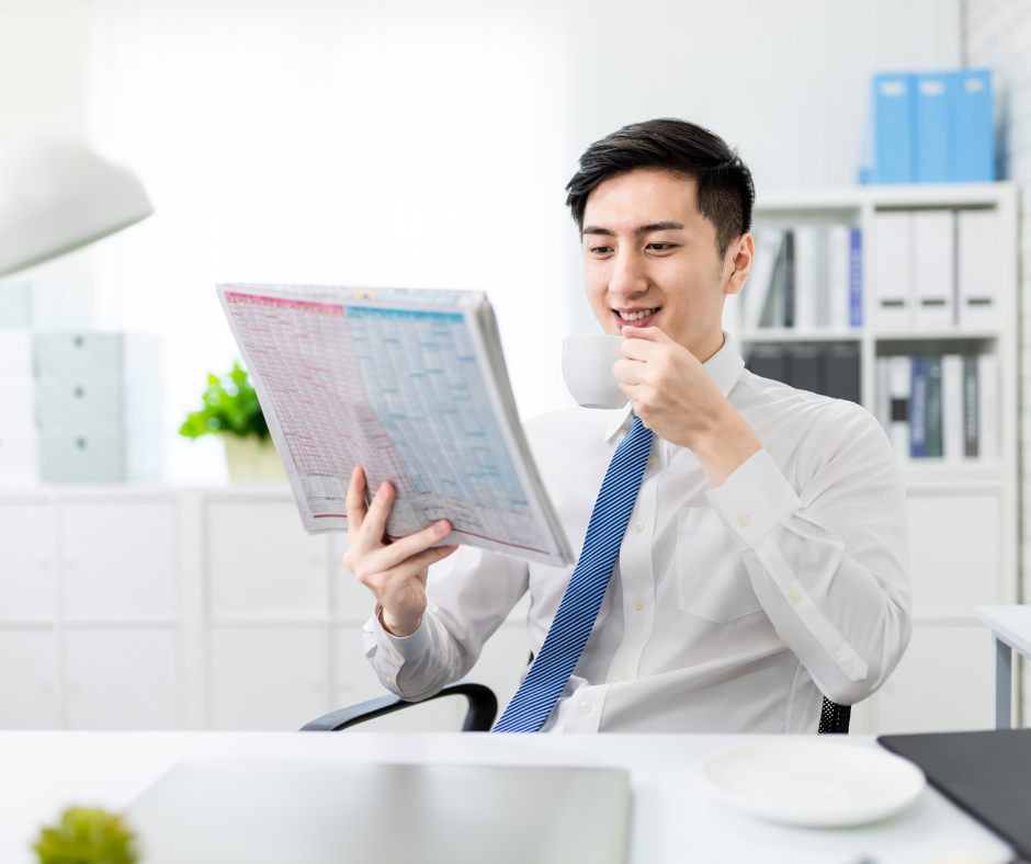 A picture of a person reading a simple and clear employee handbook