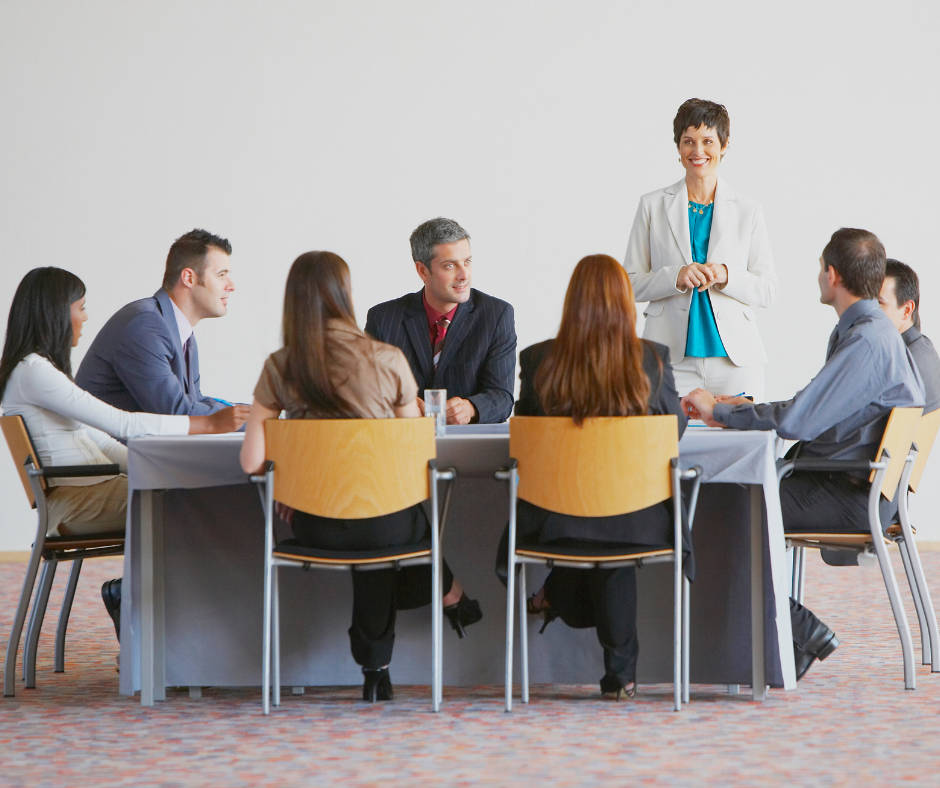 Group of people in a meeting discussing health and wellness benefits