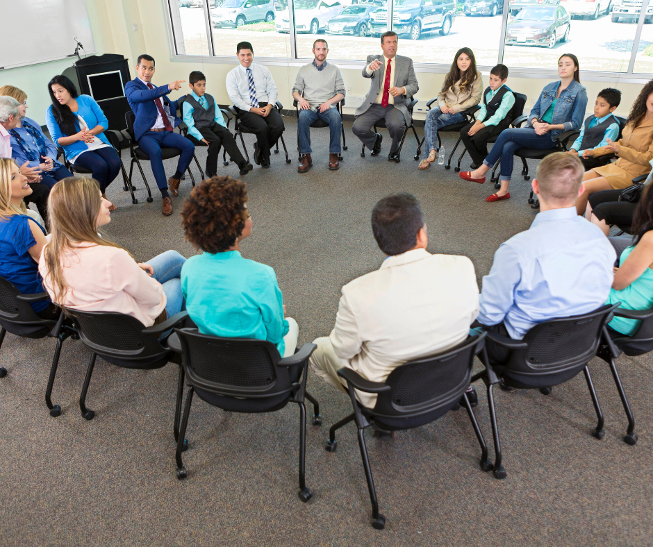 Illustration of a diverse group of employees discussing benefits and financial support programs at American Family Insurance Group. This image represents the comprehensive benefits and financial support outlined in the handbook.